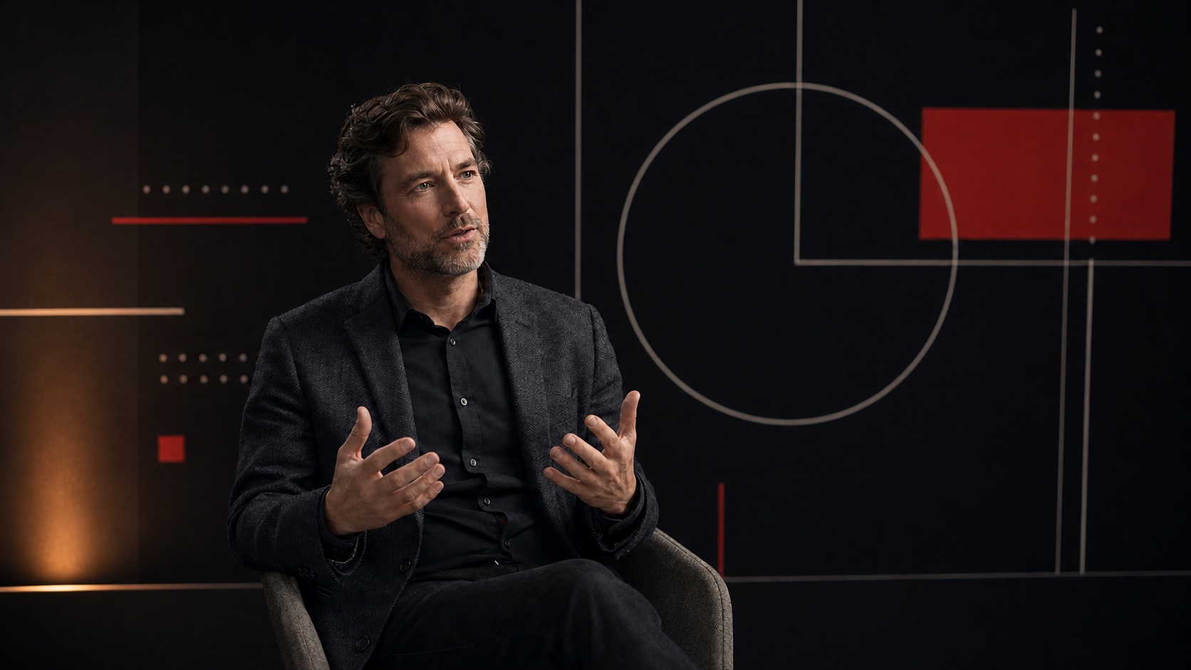 Male expert facing left inside a finished editorial interview setting